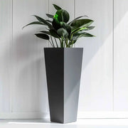 A large planter overflowing with colorful flowers.